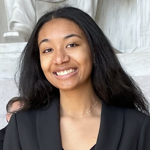 Farah Almadani stands in front of the Lincoln Memorial.