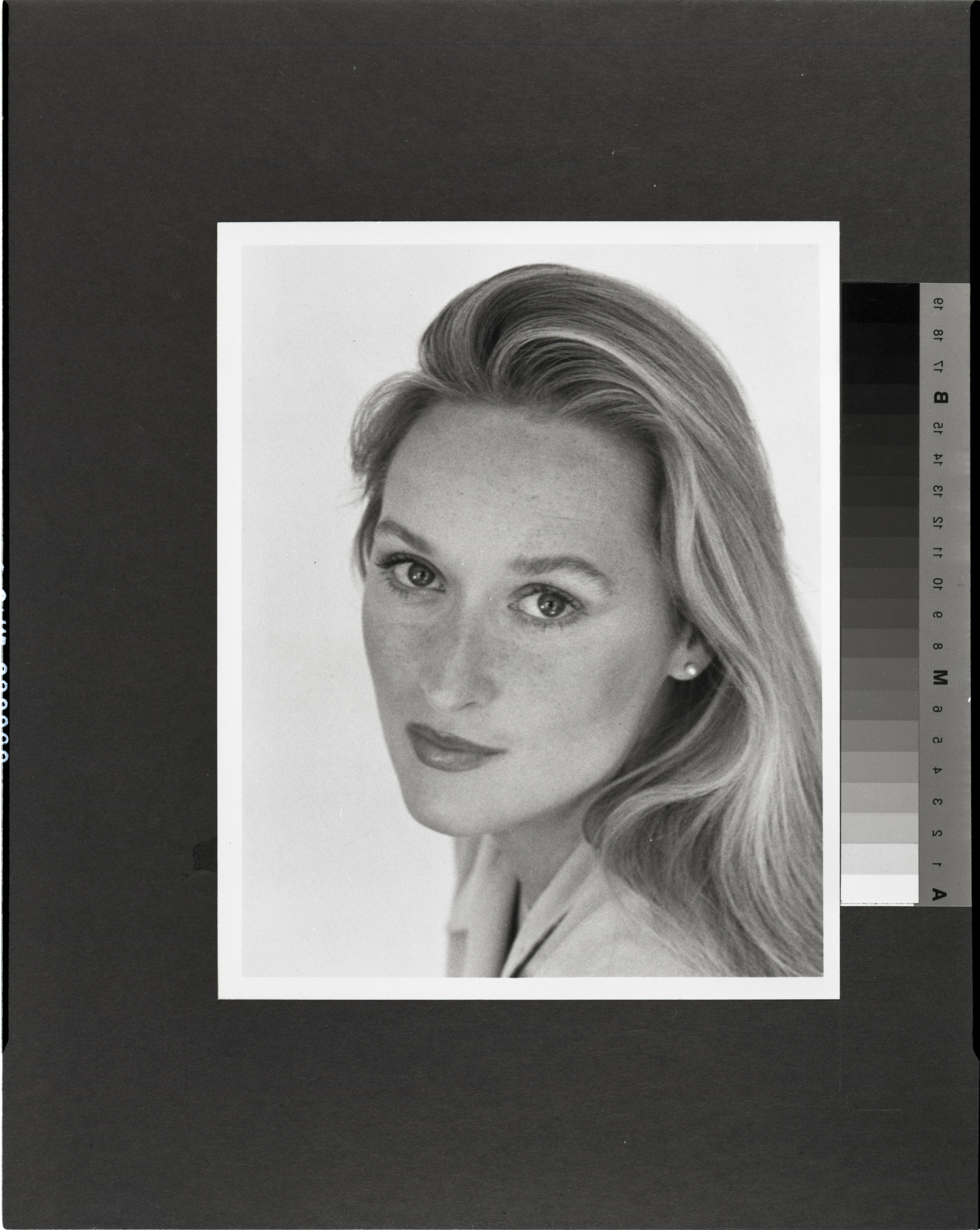 A black-and-white headshot of Meryl Streep