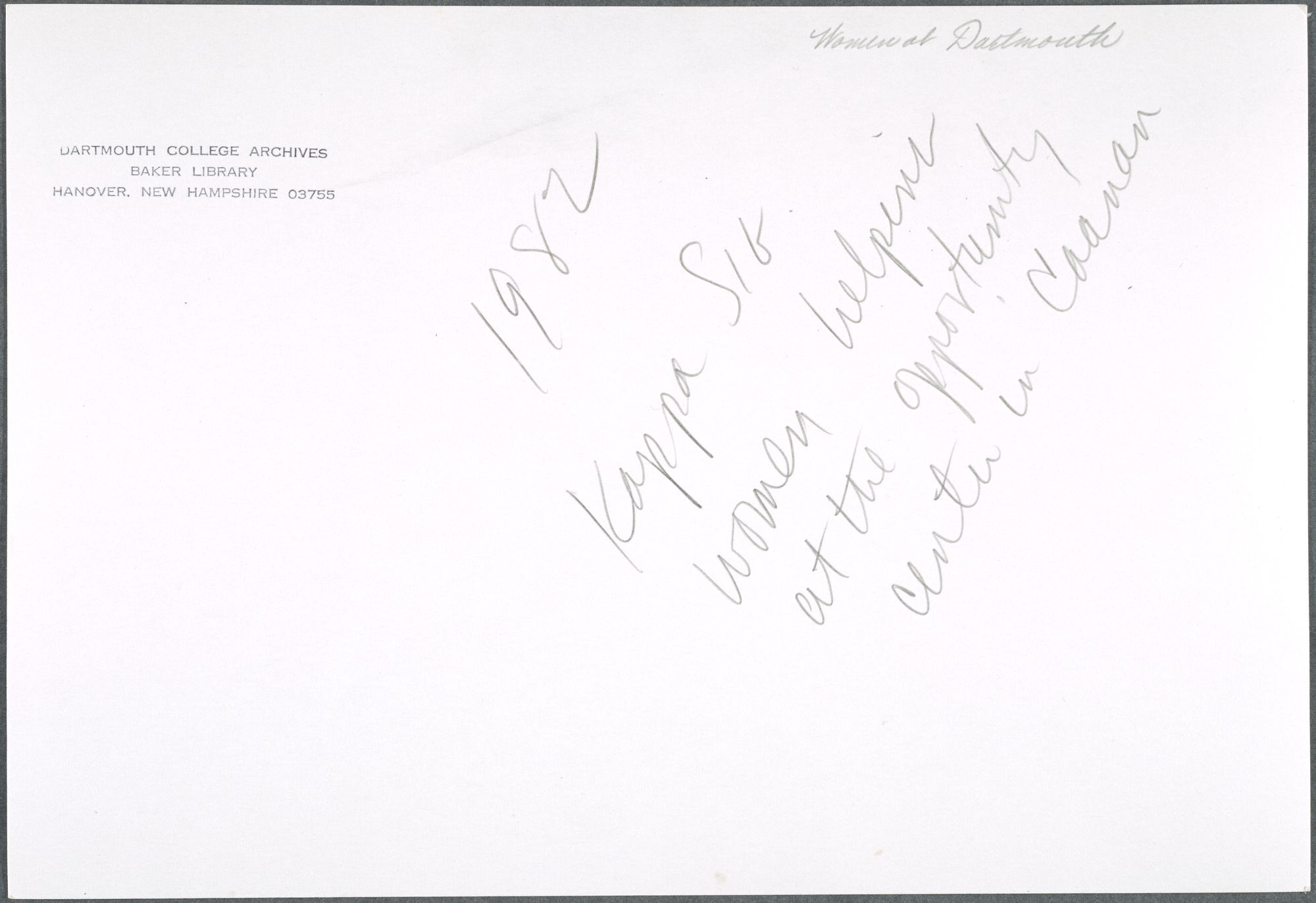 The back of a photograph with handwriting that notes the women are volunteering.