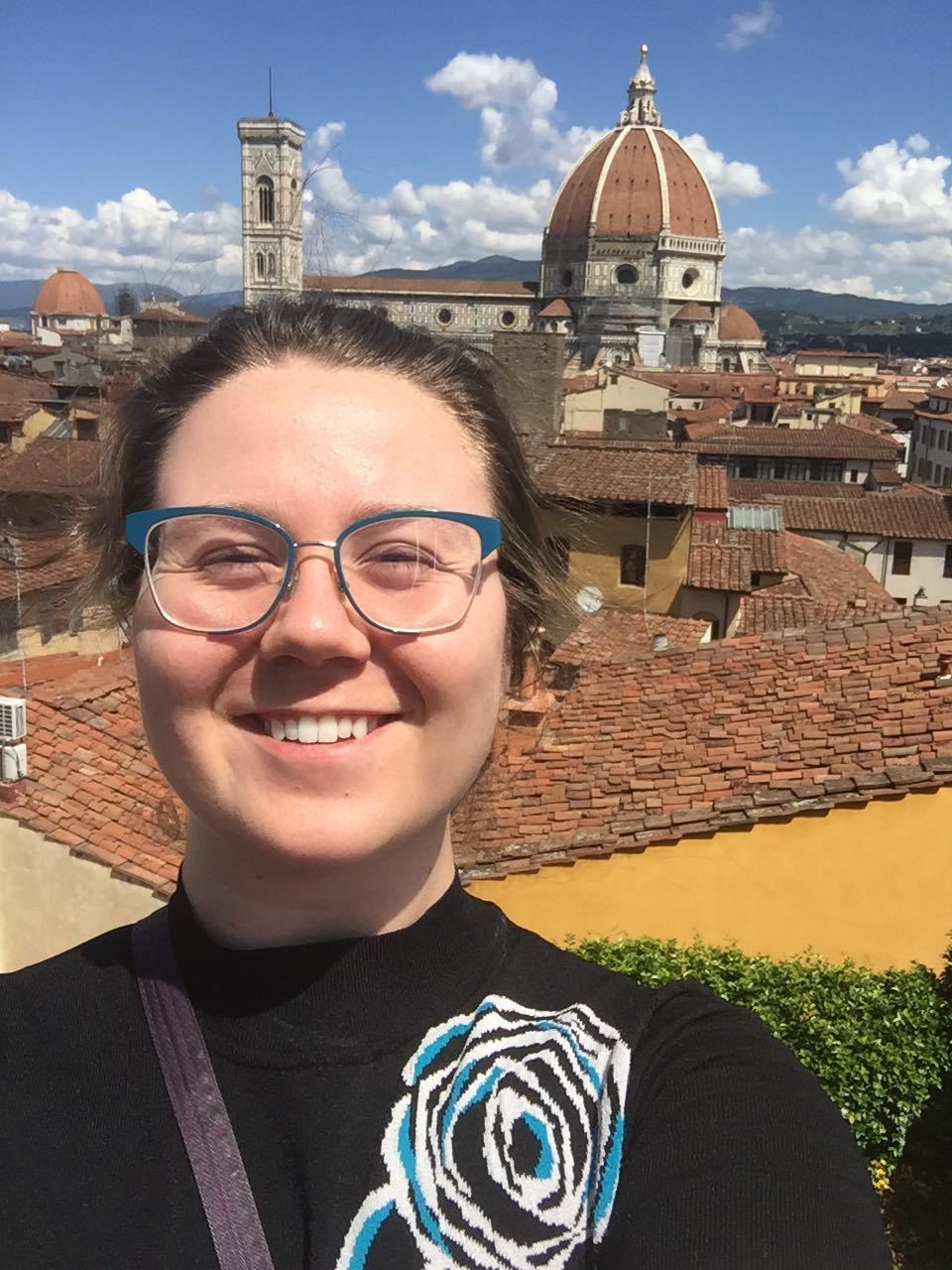 Grace Hanselman, one of two Summer 2019 Historical Accountability Student Research Fellows, standing in front of a domed building.