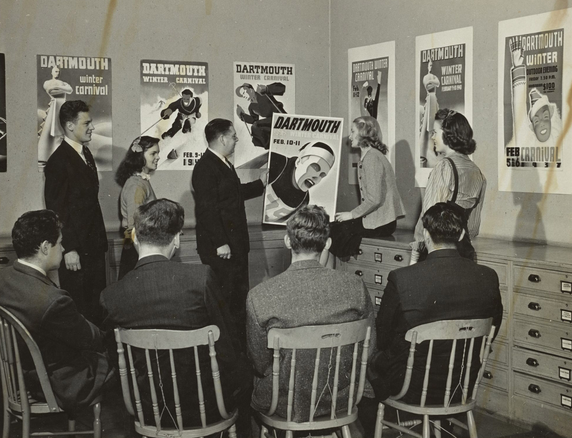Group of people viewing Winter Carnival posters