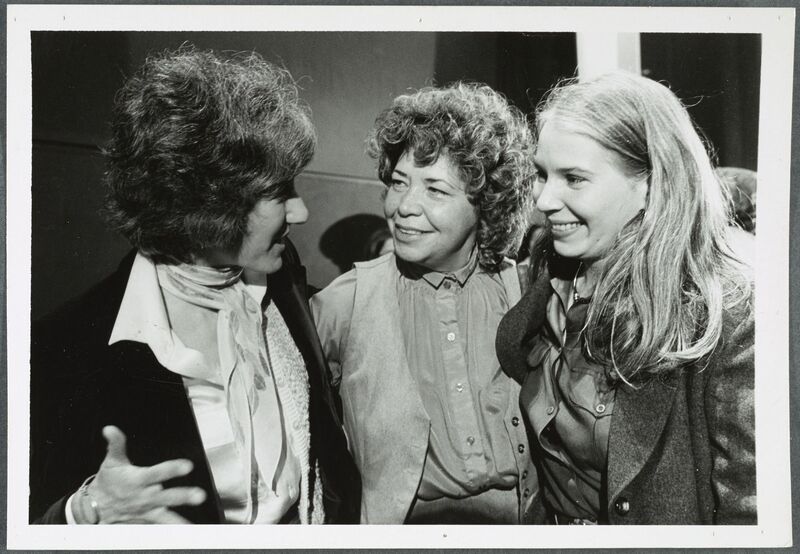 A black-and-white photograph of three women faculty.