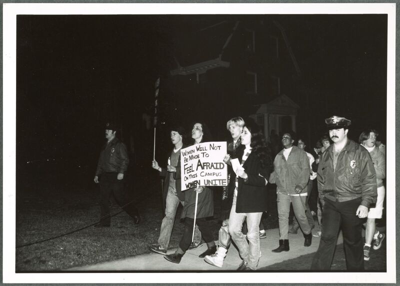 A black-and-white photograph of students marching.
